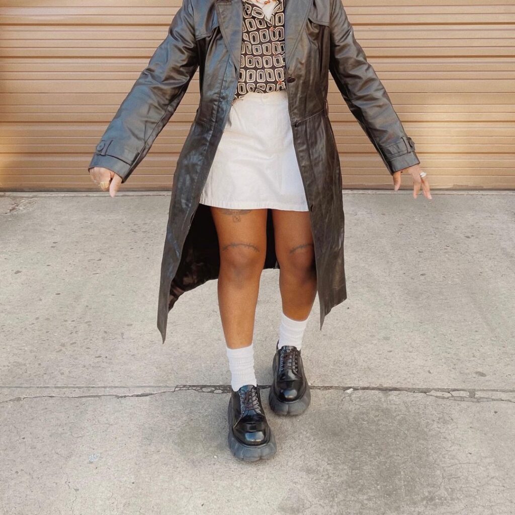 Outfit photo of a person wearing a vintage leather jacket