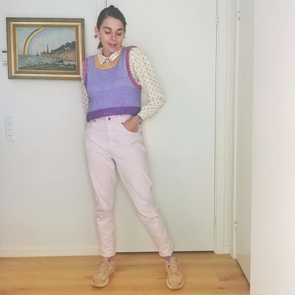 Photo of a person wearing a fall vintage outfit with a preppy knit vest