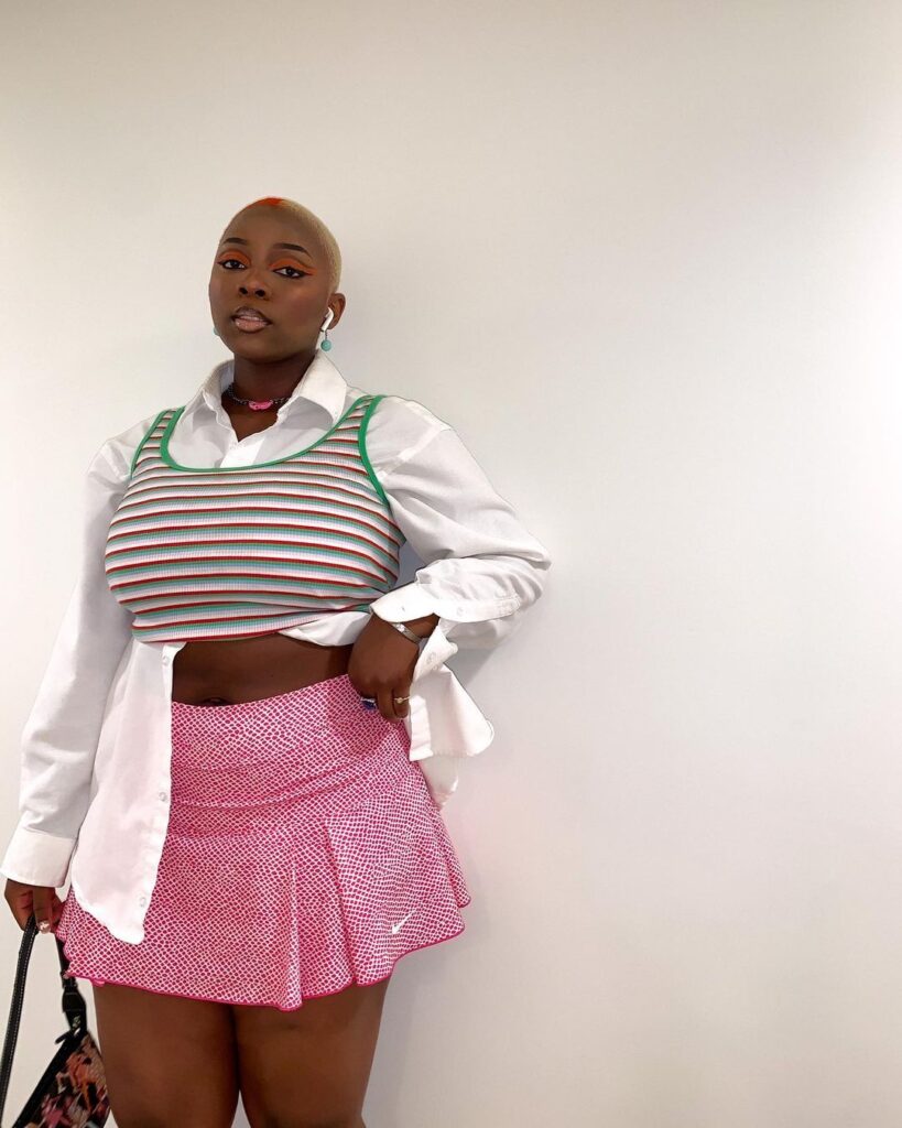 Photo of a person wearing a fall vintage outfit with a preppy knit vest